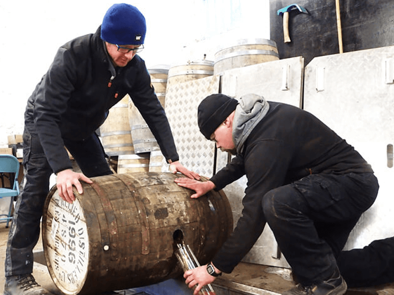 Art of Maturation - Men rolling barrels